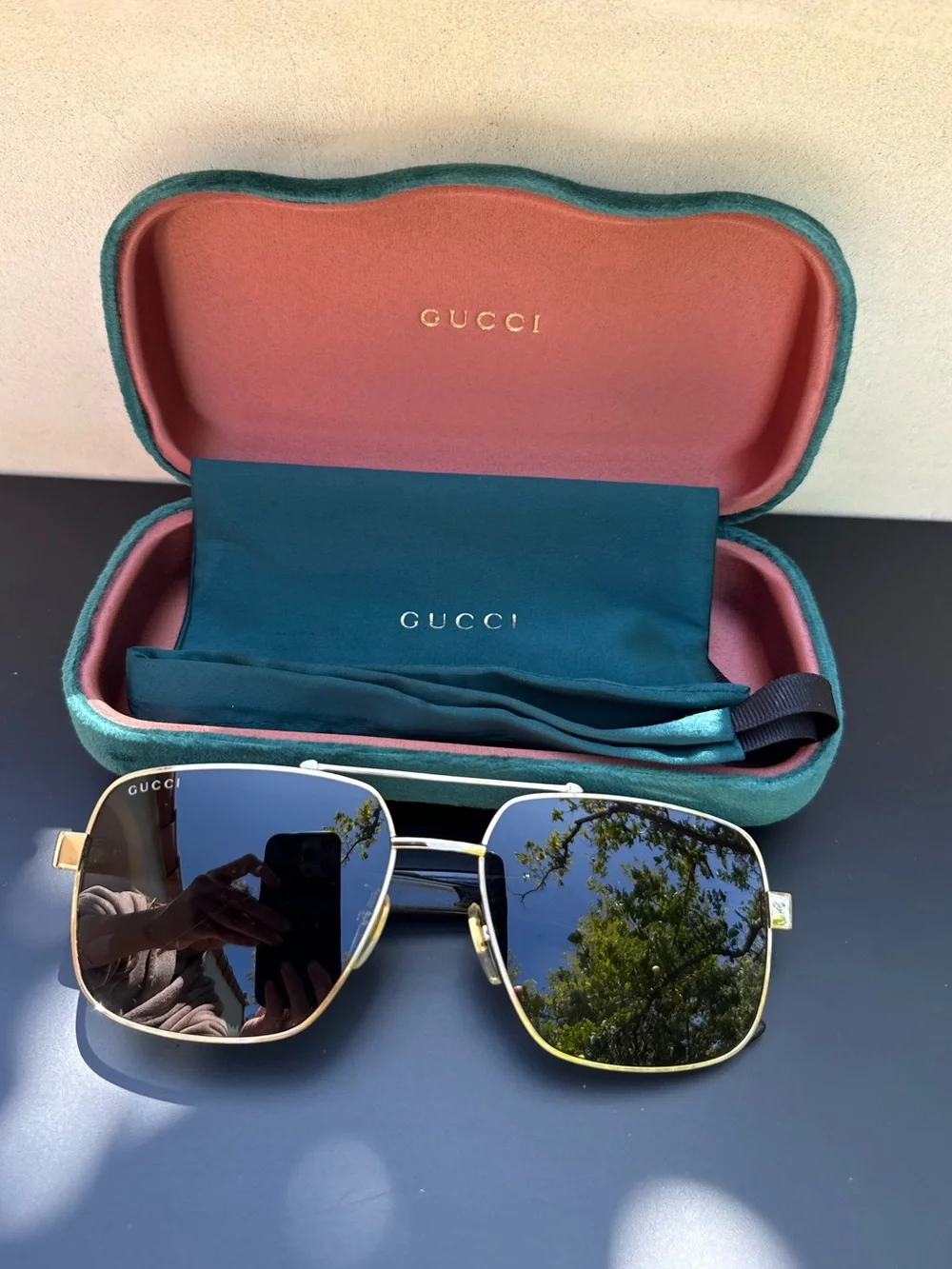 Gucci Men’s Gold Frame Sunglasses with Blue Reflective Lenses
